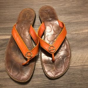 Coach orange flip flops